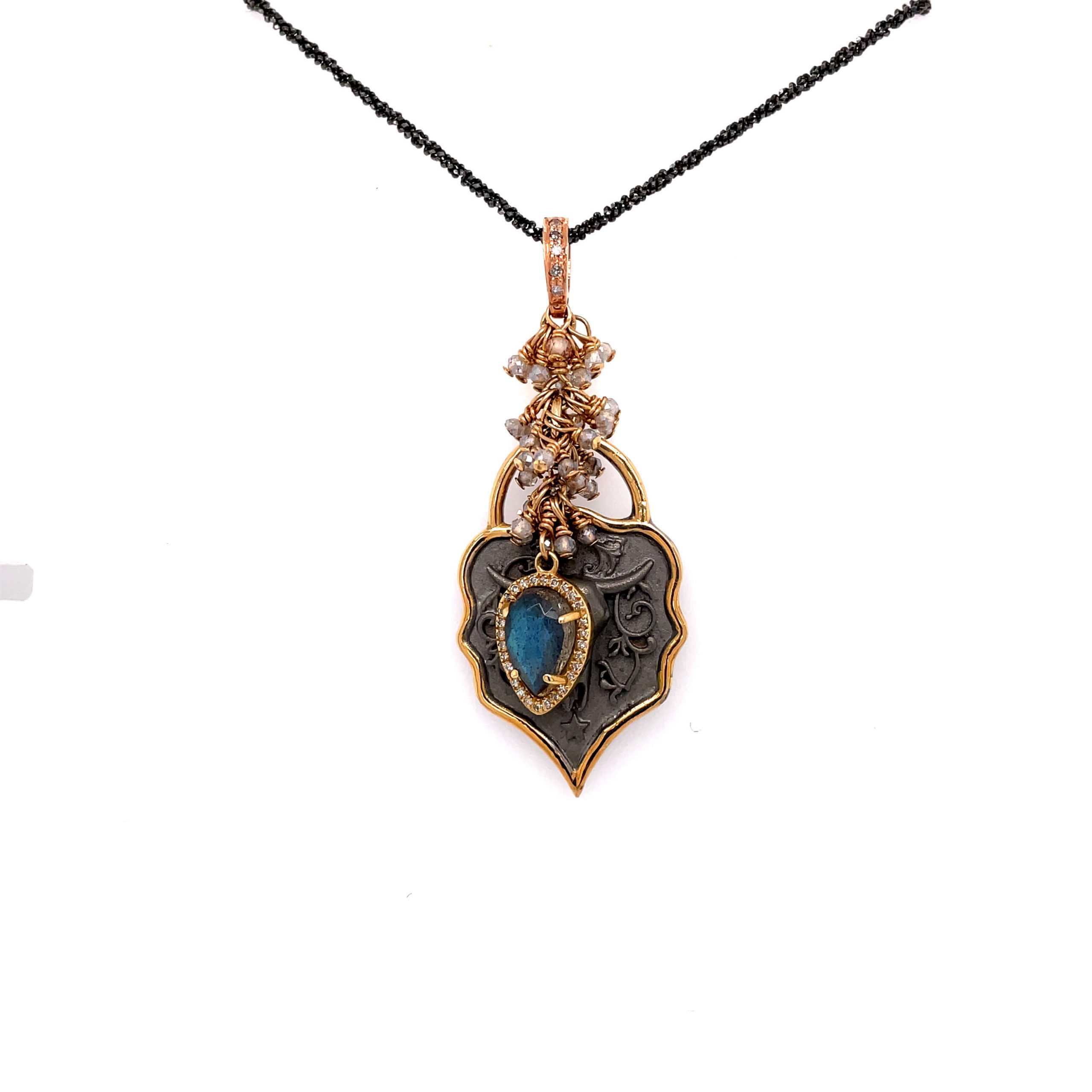 One yellow gold necklace with unique crafted design pendant, sets on a white background.