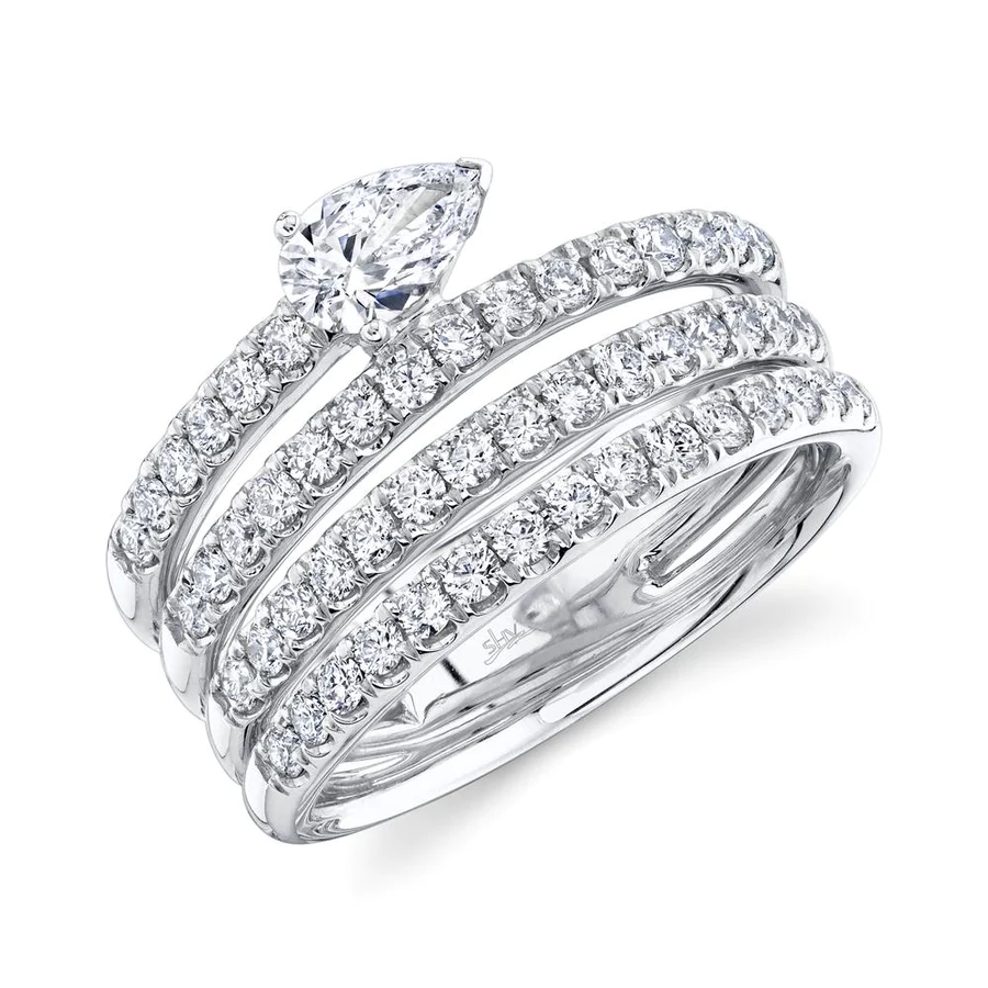 One white gold ring crafted with pave set diamonds, this multi-layered white gold ring features a pear-shaped stone and it is placed on a white background