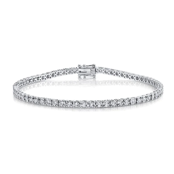 One white gold tennis bracelet facing the camera. The bracelet adorned with diamonds is set in a continuous line.