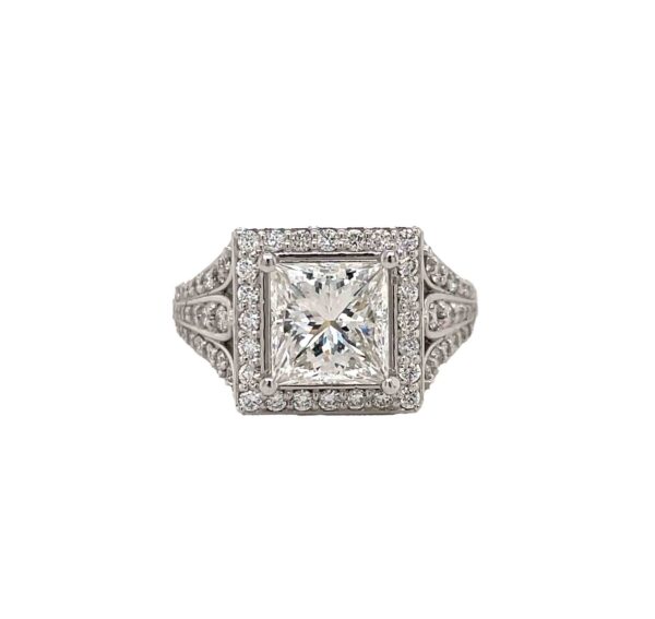 One white gold ring featuring a square-shaped center diamond with additional diamond accents adorning the ring band.