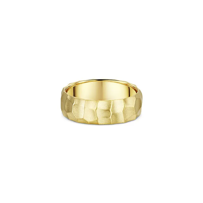 One gold ring with a band design that features a bevelled edge pattern.