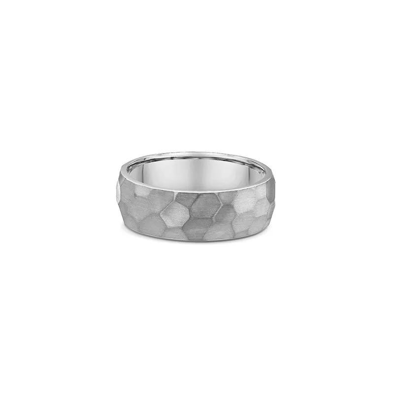 One titanium ring with a band design that features a bevelled edge pattern.