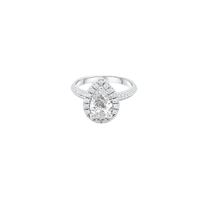 One white gold ring features a central pear-shaped diamond surrounded by smaller single-cut diamonds, with additional diamond accents adorning the ring band.