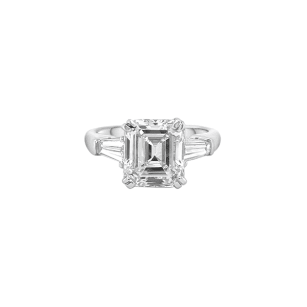 One white gold ring featuring two diamond accents between a center-mounted square-shaped diamond.