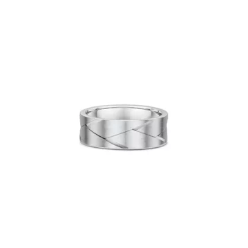 One silver ring featuring a braided cut pattern along its band.