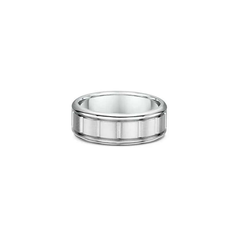 One silver band ring with a band design that features vertical lines pattern. The silver composition of the ring lends it a bright and reflective appearance, directly facing the camera.