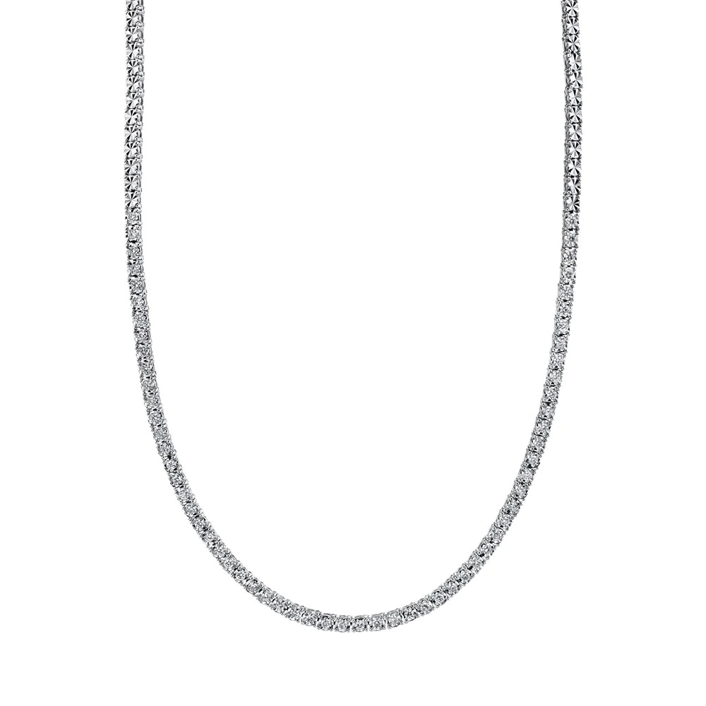 One white gold tennis necklace. The necklace adorned with diamonds are set in a continuous line.