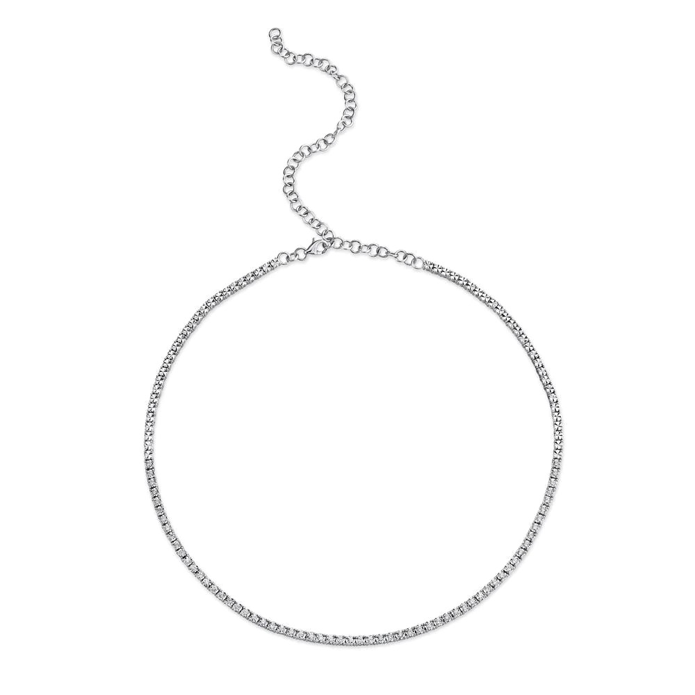 One white gold tennis necklace facing the camera. The necklace adorned with diamonds are set in a continuous line.