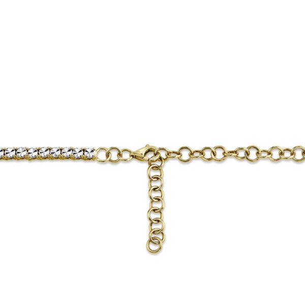 One yellow gold tennis necklace in close-up view from the camera showing the lock options. The necklace adorned with diamonds are set in a continuous line.