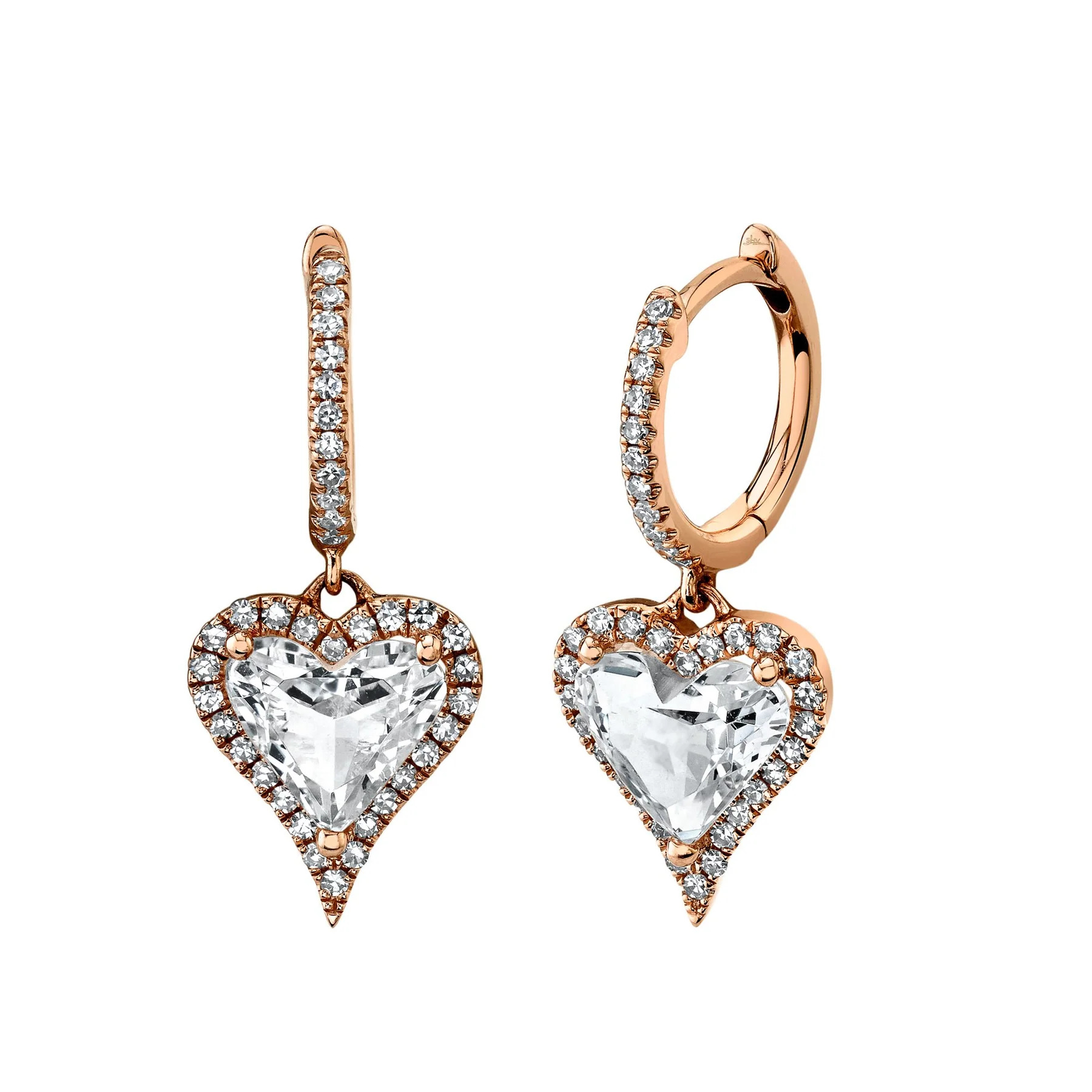 Two rose gold earrings featuring a central heart shape with a white topaz gemstone and surrounded by diamonds. The heart-shaped pendant hangs from the earring band with diamonds.