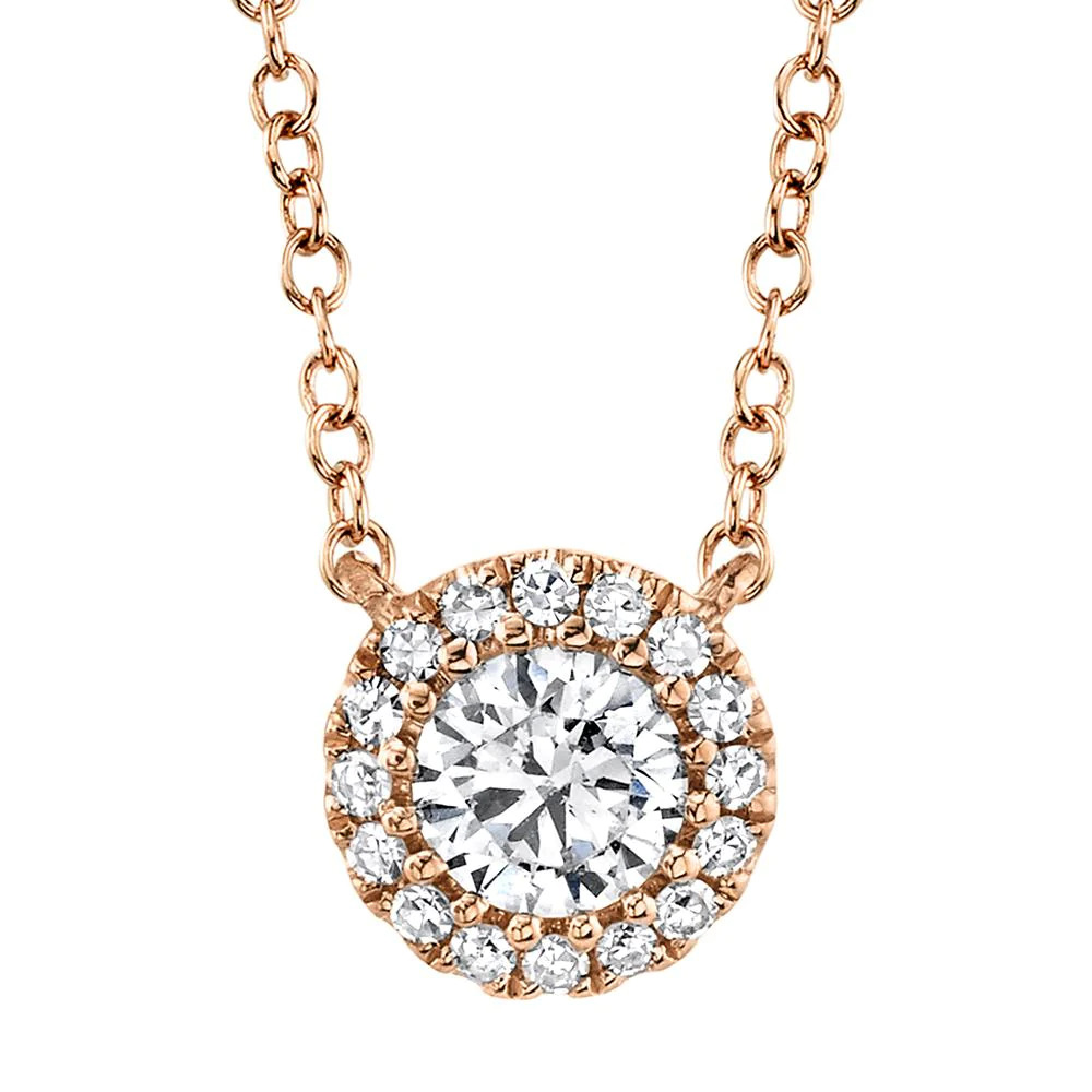 One rose gold necklace directly facing the camera. The necklace features a round pendant has center diamond surrounded by smaller side diamonds.