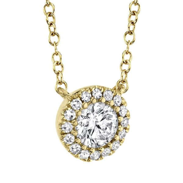 One yellow gold necklace slightly facing on the left side from the camera. The necklace features a round pendant has center diamond surrounded by smaller side diamonds.