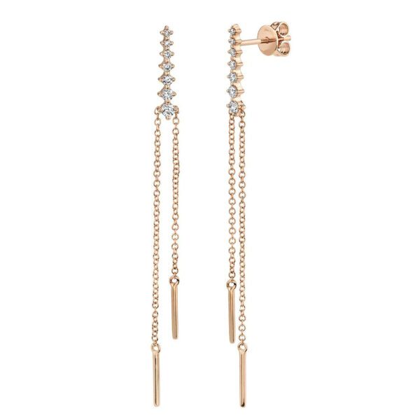 Two rose gold earrings. The earrings feature seven diamonds with a thin chain and simple plated steel at the tip ends of the chain.