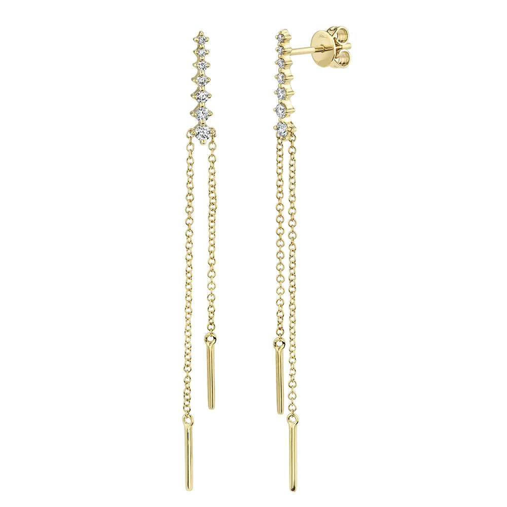 Two yellow gold earrings. The earrings feature seven diamonds with a thin chain and simple plated steel at the tip ends of the chain.