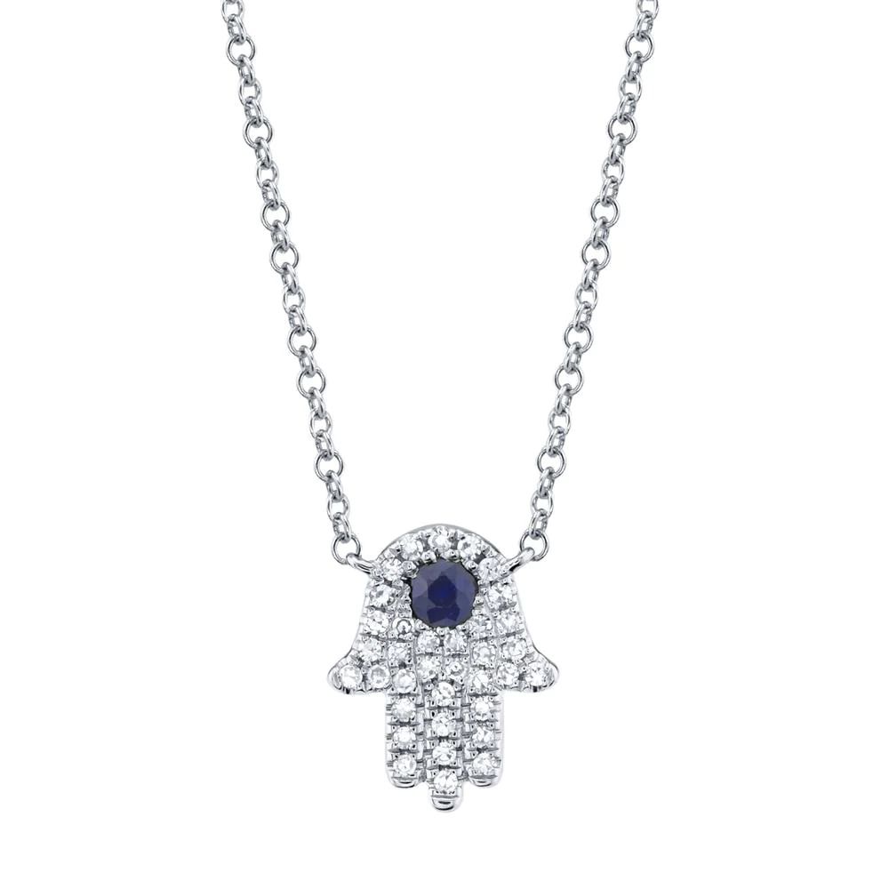 One white gold hamsa necklace. The Hamsa pendant is likely designed hand-shaped symbol and the blue sapphire stones are incorporated into the center of the pendant, flank by small diamonds.