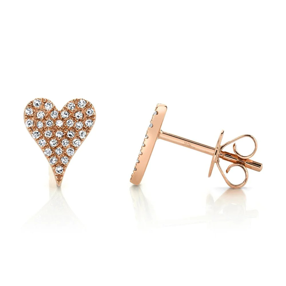 Two rose gold stud earrings. The earring on the right faces the camera, while the earring on the left is facing on the right. The earrings feature a heart-shaped design with diamond stones.