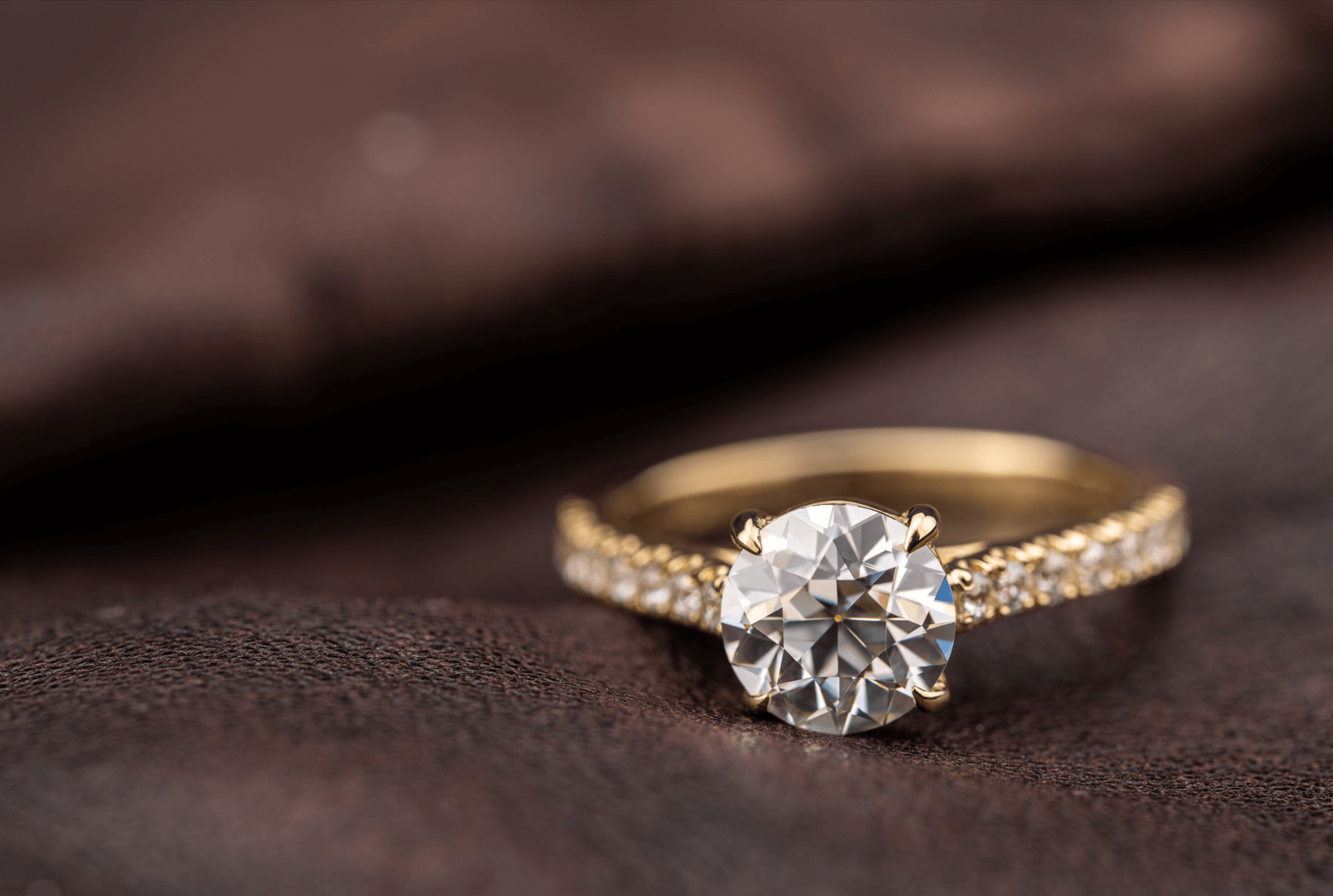 Diamond ring on a brown background